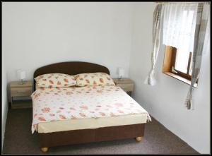 Posteľ alebo postele v izbe v ubytovaní Apartment Šedivý