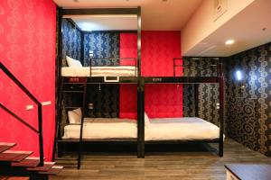 Postel nebo postele na pokoji v ubytování Place‧X Hotel