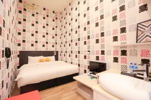 Postel nebo postele na pokoji v ubytování Place‧X Hotel