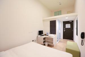 Postel nebo postele na pokoji v ubytování Place‧X Hotel