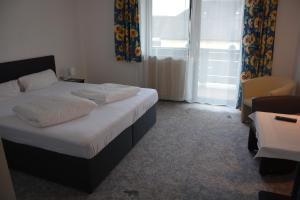 Postel nebo postele na pokoji v ubytování Hotel Böhmerwaldhof