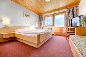 TV in/ali zabaviščno središče v nastanitvi Hotel Burtschahof
