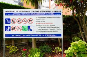 a sign that is in front of a building at Alva Park in Lloret de Mar