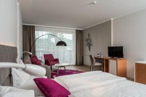 Posteľ alebo postele v izbe v ubytovaní Seehotel Vinzenz