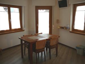 TV a/nebo společenská místnost v ubytování Casa Screm - Appartamenti e Camere -Rigolato - UD
