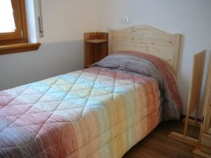 Postel nebo postele na pokoji v ubytování Casa Screm - Appartamenti e Camere -Rigolato - UD