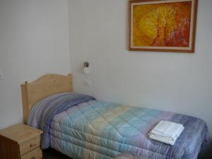 Postel nebo postele na pokoji v ubytování Casa Screm - Appartamenti e Camere -Rigolato - UD