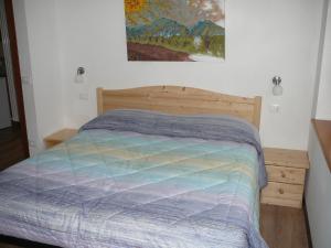 Postel nebo postele na pokoji v ubytování Casa Screm - Appartamenti e Camere -Rigolato - UD