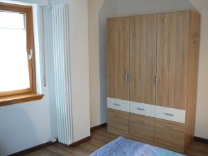 Postel nebo postele na pokoji v ubytování Casa Screm - Appartamenti e Camere -Rigolato - UD