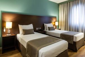 Cama ou camas em um quarto em Hotel Panamby São Paulo