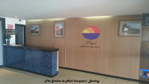 a restaurant with a sign on a wall at Flat Jardim de Alah in Salvador +21 photos