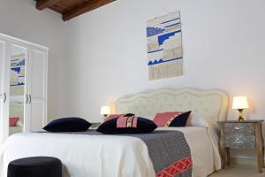 Katil atau katil-katil dalam bilik di Ogliastra Luxury Apartment