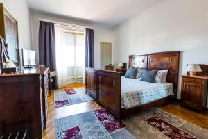 Posteľ alebo postele v izbe v ubytovaní Gianduja B&B