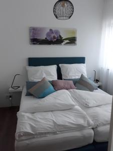 Postel nebo postele na pokoji v ubytování Aulbach' s Appartments