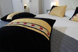 A bed or beds in a room at Ogliastra Luxury Apartment