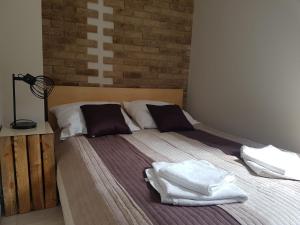 Ένα ή περισσότερα κρεβάτια σε δωμάτιο στο Apartament Country Centrum