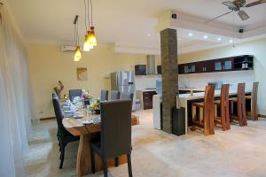 a dining room and kitchen with a table and chairs at O Villas Seminyak - 2026 Earlybirds ON SALE! in Seminyak