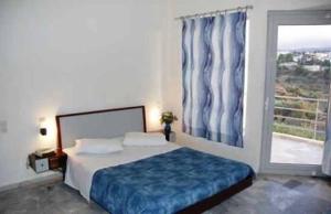 Posteľ alebo postele v izbe v ubytovaní Rodon Hotel