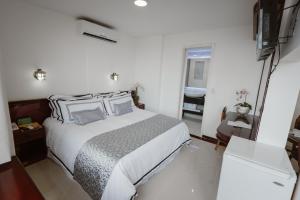 Postel nebo postele na pokoji v ubytování Hotel Arenal