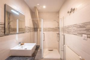 a bathroom with a sink and a shower at Hostellerie Bellevue in Rocamadour