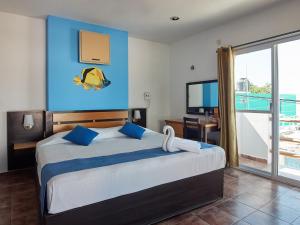 Łóżko lub łóżka w pokoju w obiekcie Hotel Tabasco Rio