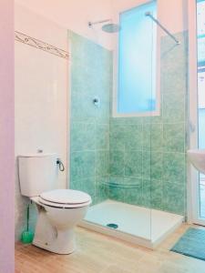 a bathroom with a shower with a toilet and a tub at CasaLella in Viareggio +9 photos