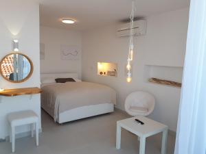 מיטה או מיטות בחדר ב-Alto Rooms and Apartments
