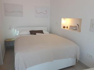מיטה או מיטות בחדר ב-Alto Rooms and Apartments