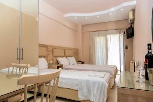 TV a/nebo společenská místnost v ubytování Le Monde SeaView Suites