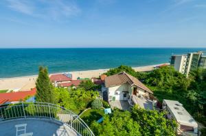 a view of a beach and a building and the ocean at Villa White Dove in Golden Sands