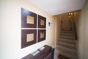 a hallway with stairs and pictures on the wall at Los Toneles in Puerto de Santa Cruz