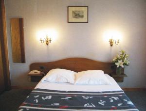 Postel nebo postele na pokoji v ubytování Le Chalet