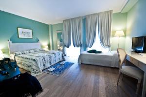 Voodi või voodid majutusasutuse OSTUNI PALACE - Hotel Bistrot & SPA toas