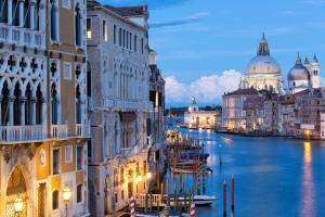 a view of a canal with buildings and a cathedral at Venice Heaven Apartments San Marco 1 & 2, the Elegant Residence a stone s throw from St Mark s Square in Venice