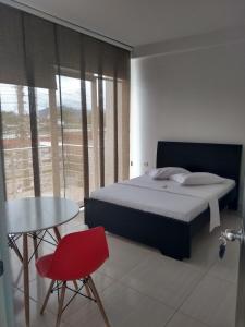 מיטה או מיטות בחדר ב-Hotel Gran Estacion Florencia