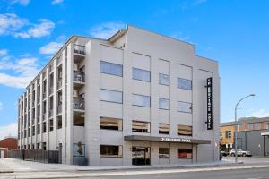 a white building on the corner of a street at CH Boutique Hotel, an Ascend Collection Hotel in Tamworth