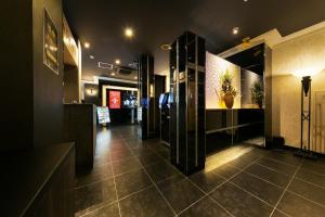 a lobby of a restaurant with a tile floor at Hotel Eldia Luxury Kobe (Adult Only) in Kobe