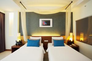 Access Resort & Villas - SHA Plus客房内的一张或多张床位