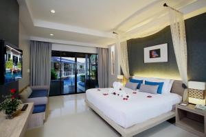 Access Resort & Villas - SHA Plus客房内的一张或多张床位
