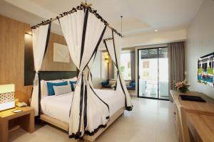 Access Resort & Villas - SHA Plus客房内的一张或多张床位