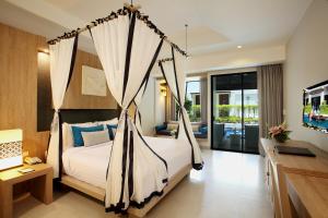 Access Resort & Villas - SHA Plus客房内的一张或多张床位