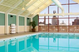 a swimming pool with a view of the city at Hyatt Regency Rochester in Rochester