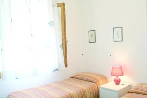 Katil atau katil-katil dalam bilik di Villa Cedro