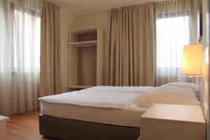 Postel nebo postele na pokoji v ubytování Hotel Centro