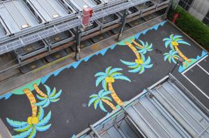 an aerial view of a painting of palm trees on a building at HOTEL MYSTAYS Maihama in Urayasu
