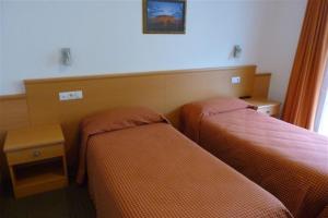 Postel nebo postele na pokoji v ubytování Garni Cremona