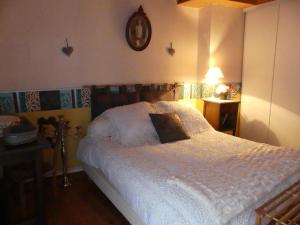 En eller flere senge i et værelse på La maison des vacances