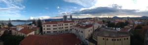 an aerial view of a city with buildings at Marysel Rooms in Olbia
