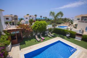 an aerial view of a swimming pool on a apartment at Villa Elias in Ayia Napa