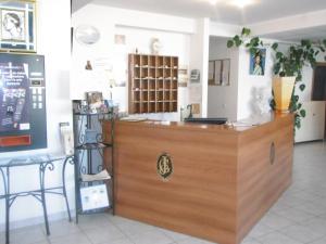 a shop with a wooden counter in a room at Hôtel Sampiero in Bastia